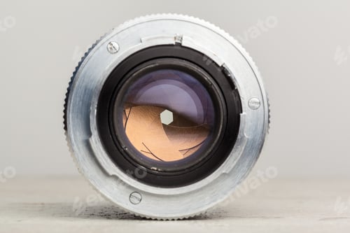 Preview: Close-up view of a camera lens showing the aperture mechanism and intricate details