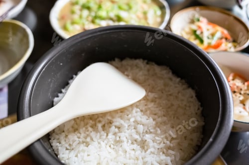 Preview: Chinese Dinner With Rice Bucket And Dishes On Table