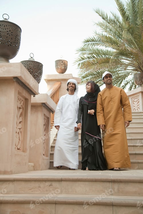 Preview: Three friends taking a stroll in traditional attire