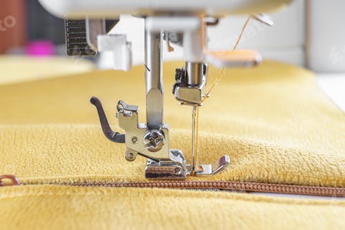 Preview: Modern Sewing Machine With Yellow Velours Fabric Close Up