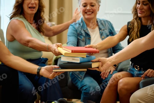 Preview: Group of people sharing books for learning activity
