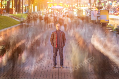 Preview: The man stand in the crowd stream. evening night time