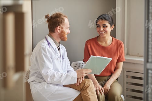 Preview: Doctor prescribing medicine to patient