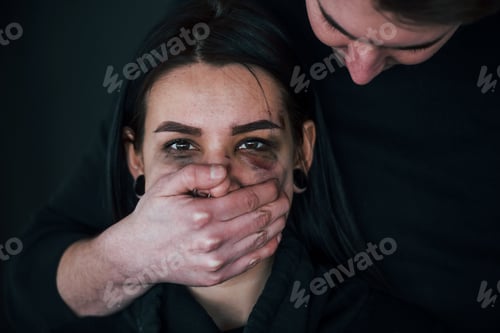 Preview: Man's hand covering her mouth. Kidnapped woman is threatened by guy