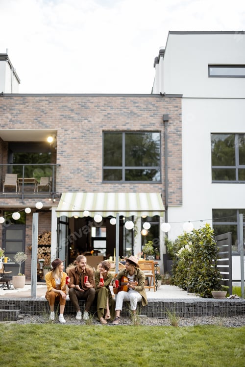 Preview: Friends gathering together on a porch of a country house