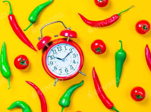 Preview: Chili pepper with tomatoes and alarm clock