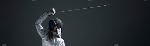 Preview: Back view of fencer training with rapier isolated on black, panoramic crop