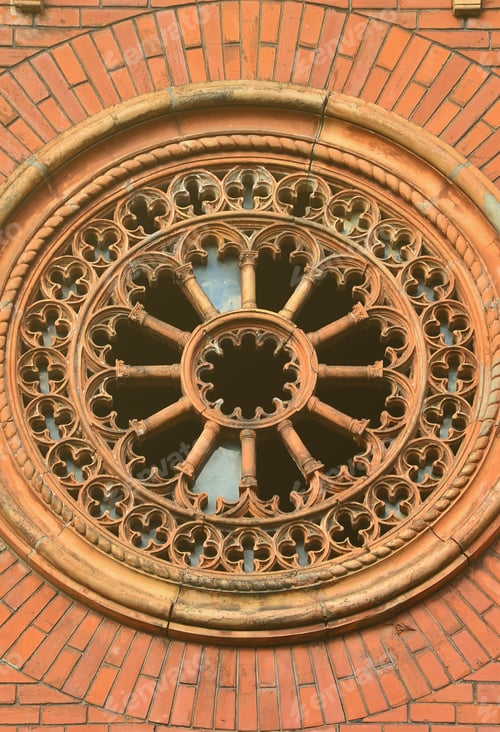 Preview: Texture front part of an ancient brick crypt with a round patterned carved window in the cemetery