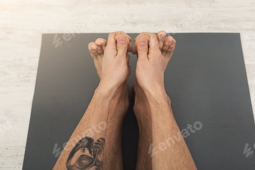 Preview: Unrecognizable Fitness Man At Stretching Training. Young Flexible Sporty Guy Makes Aerobics