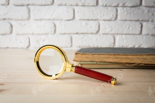 Preview: Magnifying glass and book