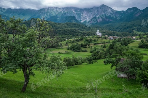 Preview: Drežnica village, Slovenia. Drone aerial view. Picturesque rural green landscape