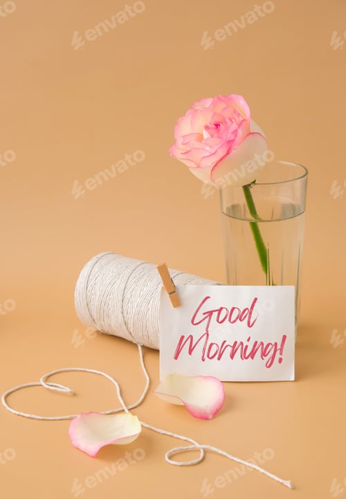 Preview: GOOD MORNING text Tender pink roses with spool of white cotton rope in heart shape on beige