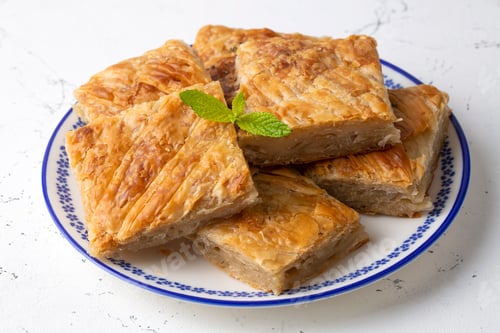 Preview: Handmade Greek spring rolls with cheese, sliced into squares. Turkish name; el yapimi tepsi boregi