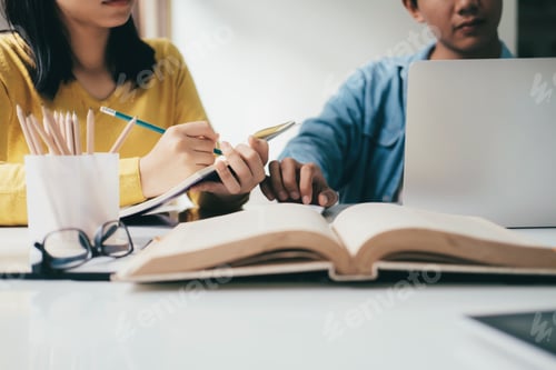 Preview: Young woman and man studying for a test or an exam