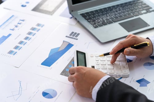 Preview: Financial businessman calculating corporate income tax data And analyzing charts of financial stocks