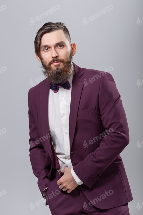Preview: People, style and fashion concept - Portrait of bearded handsome man over grey background