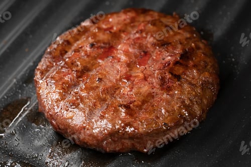 Preview: Process of roasting veggie plant-based meat cutlet on barbecue grill plate. Soybean fake patty