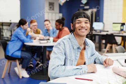 Preview: Smiling Young Man in College