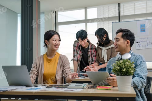 Preview: A group of professional Asian UI, UX graphic designers, or developers is in the meeting