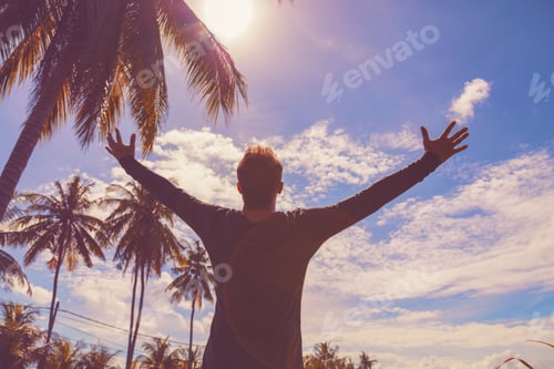 Preview: Man Enjoying Tropical Climate With Arms Wide Open.