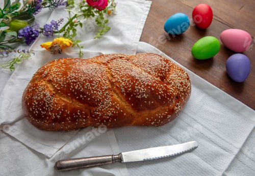 Preview: Easter sweet bread, homemade tsoureki braid and colorful Easter eggs on the table