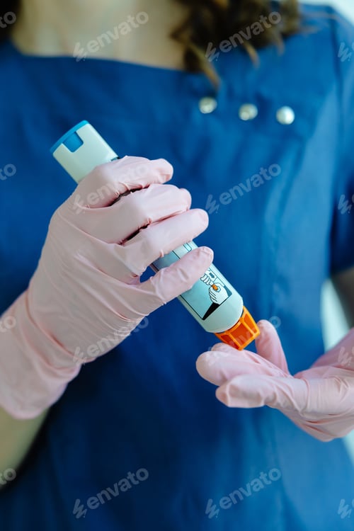 Preview: Doctor is demonstrating auto-injector syringe as an emergency treatment for allergic reaction