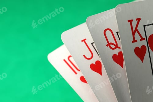 Preview: Hand of playing cards on green background, closeup. Space for text