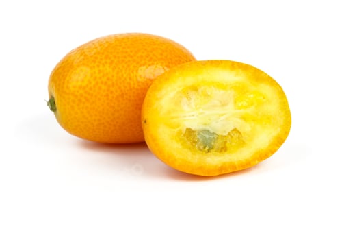 Preview: Whole and sliced kumquat fruits