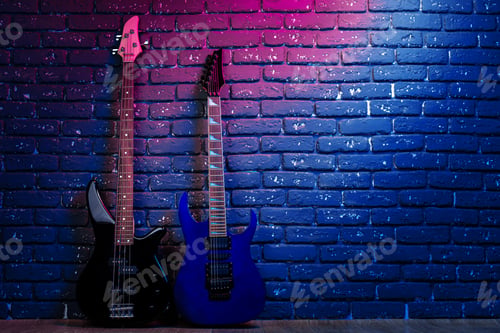 Preview: Electric guitar in neon light against dark walll