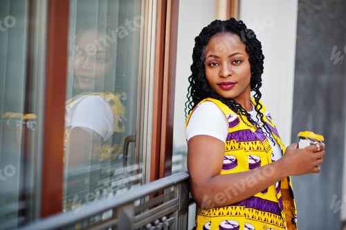 Preview: African woman in yellow