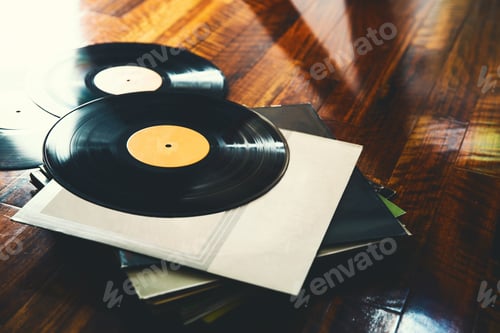 Preview: Vinyl record and a collection of albums