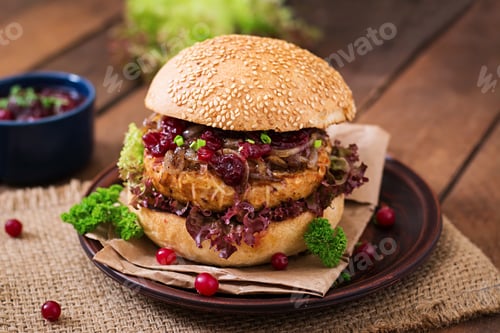 Preview: Hamburger with juicy turkey burger with cheese, caramelized onions and cranberry sauce