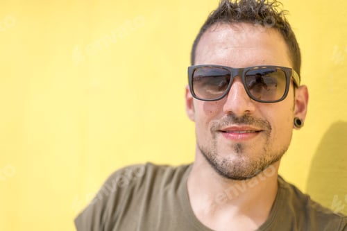 Preview: Colorful portrait of a handsome man dressed in green t-shirt