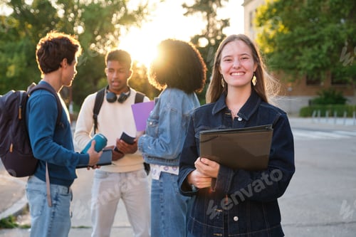 Preview: Diverse college students smiling on university campus