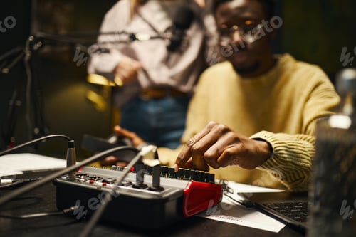Preview: Man Using Mixing Console In Studio