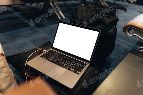 Preview: A laptop with blank screen on chair at airport