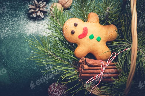 Preview: Christmas card with gingerbread man and coniferous branches in basket