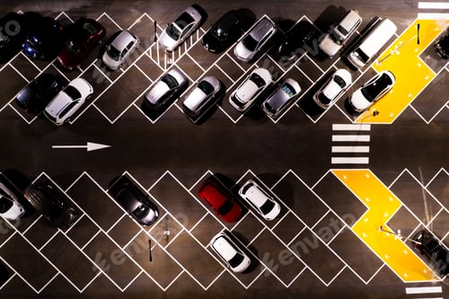 Preview: Drone aerial view of parking lots with cars at night. Crowded shopping mall outdoor car park