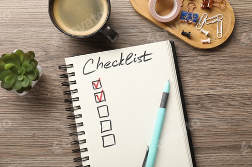 Preview: Checklist with marked checkboxes, coffee, plant and stationery on wooden table, flat lay