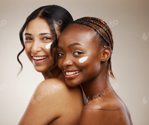 Preview: Women, cream on face and beauty with diversity, friends and inclusive skincare on studio background