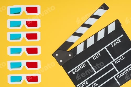 Preview: 3d glasses in vertical row and clapperboard isolated on yellow