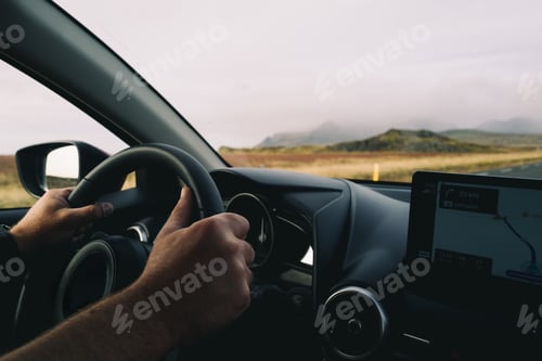 Preview: View from the car man driving using GPS in Iceland