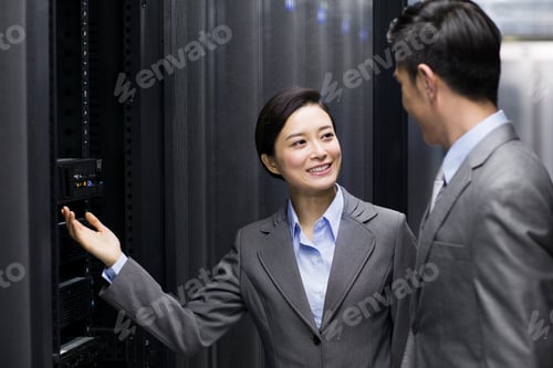 Preview: Business persons in computer room