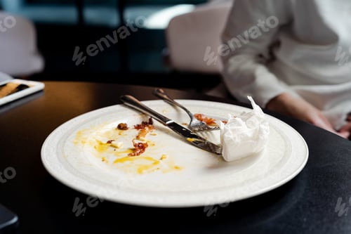 Preview: Dirty plate after eating on the table close-up