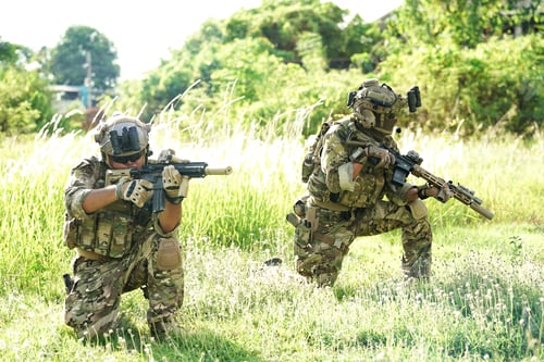 Preview: Soldier in full US MARSOC armed with assault rifle run through the abandoned building. Military