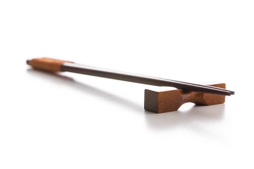 Preview: Wooden chopsticks on a wooden holder.