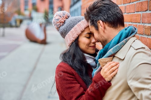 Preview: Affectionate couple in love enjoying while spending time together outdoors.