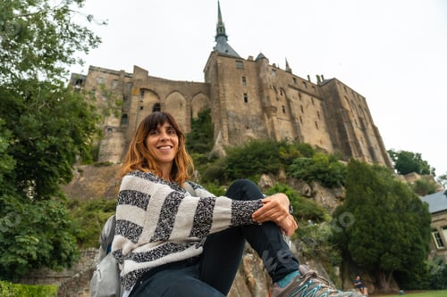 Preview: A young tourist visiting the famous Mont Saint-Michel Abbey, Normandy, France