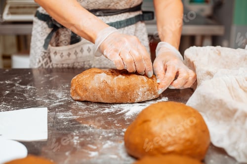 Preview: baker shaping dough for bread
