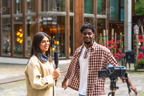 Preview: Reporter interviewing man with microphone and camera filming vlog